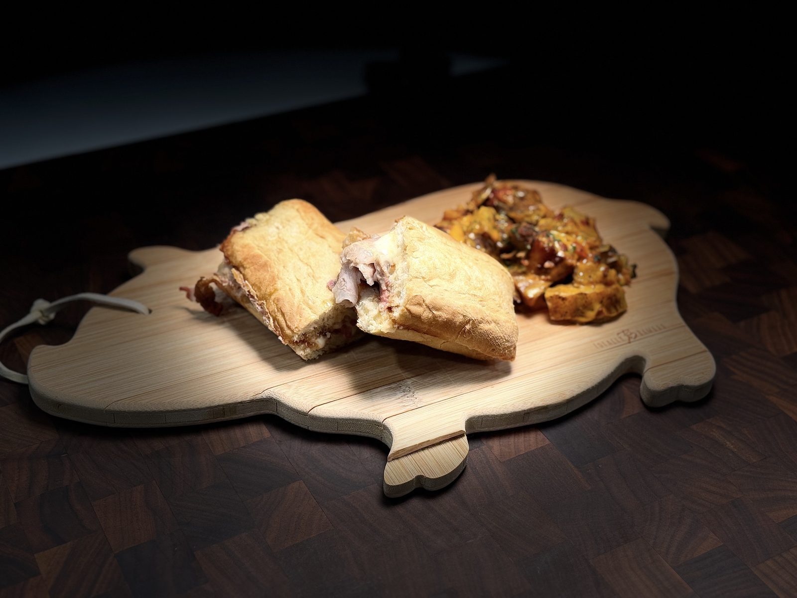 Roasted pork sandwich with melted provolone and onions on crusty bread